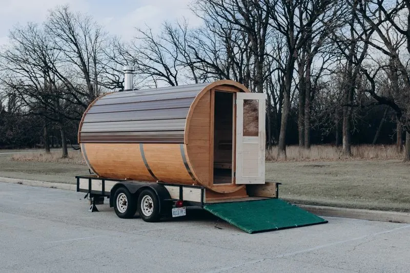 Mobile sauna with its glass door open and the ramp down